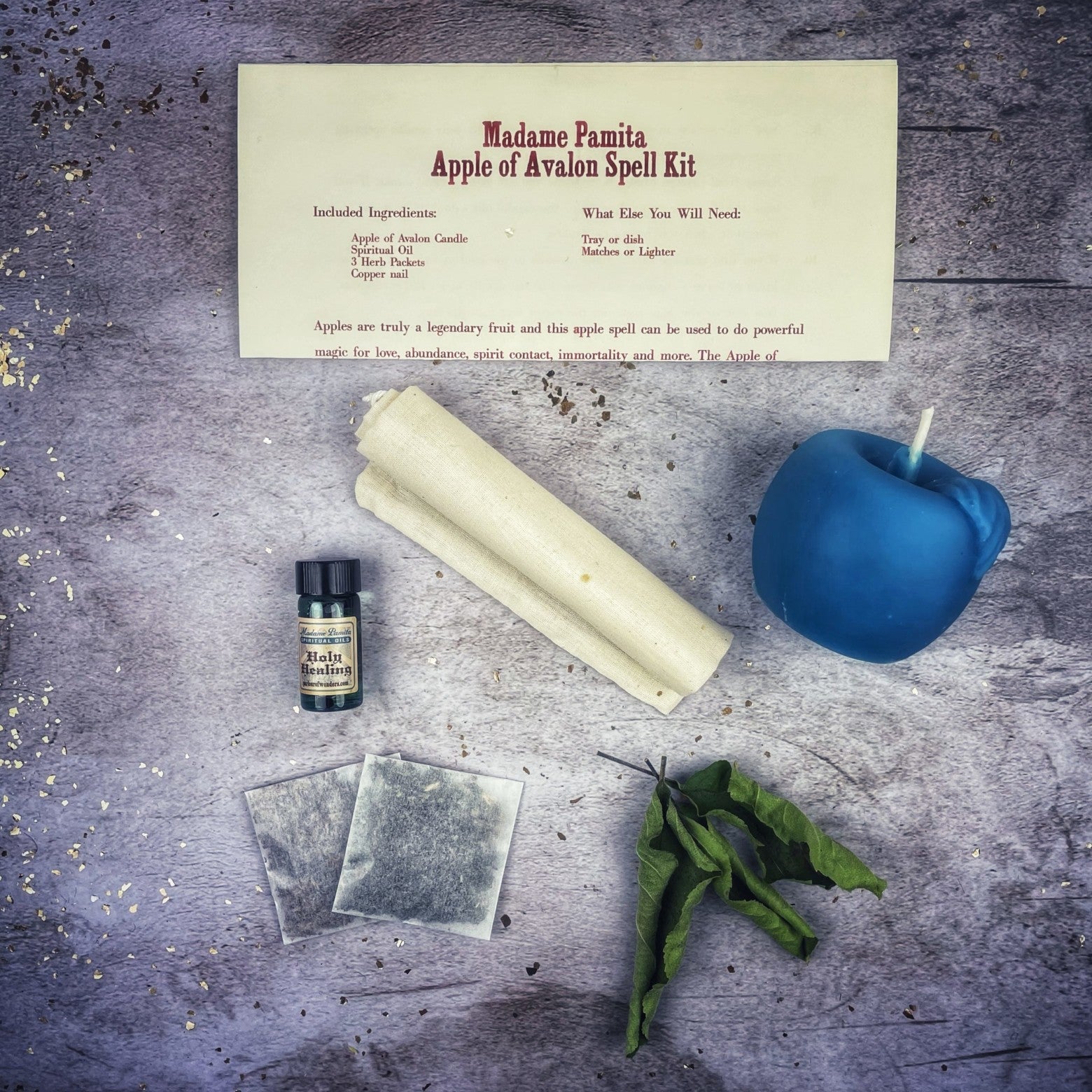 Apple of Avalon Candle Spell Kit by Parlour of Wonders with black control candles and magical symbols for love and abundance spells.
