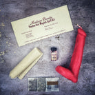 Black Phallus Candle Spell Kit from Parlour of Wonders for sexual power and attraction magic, featuring a detailed candle and spell tools.