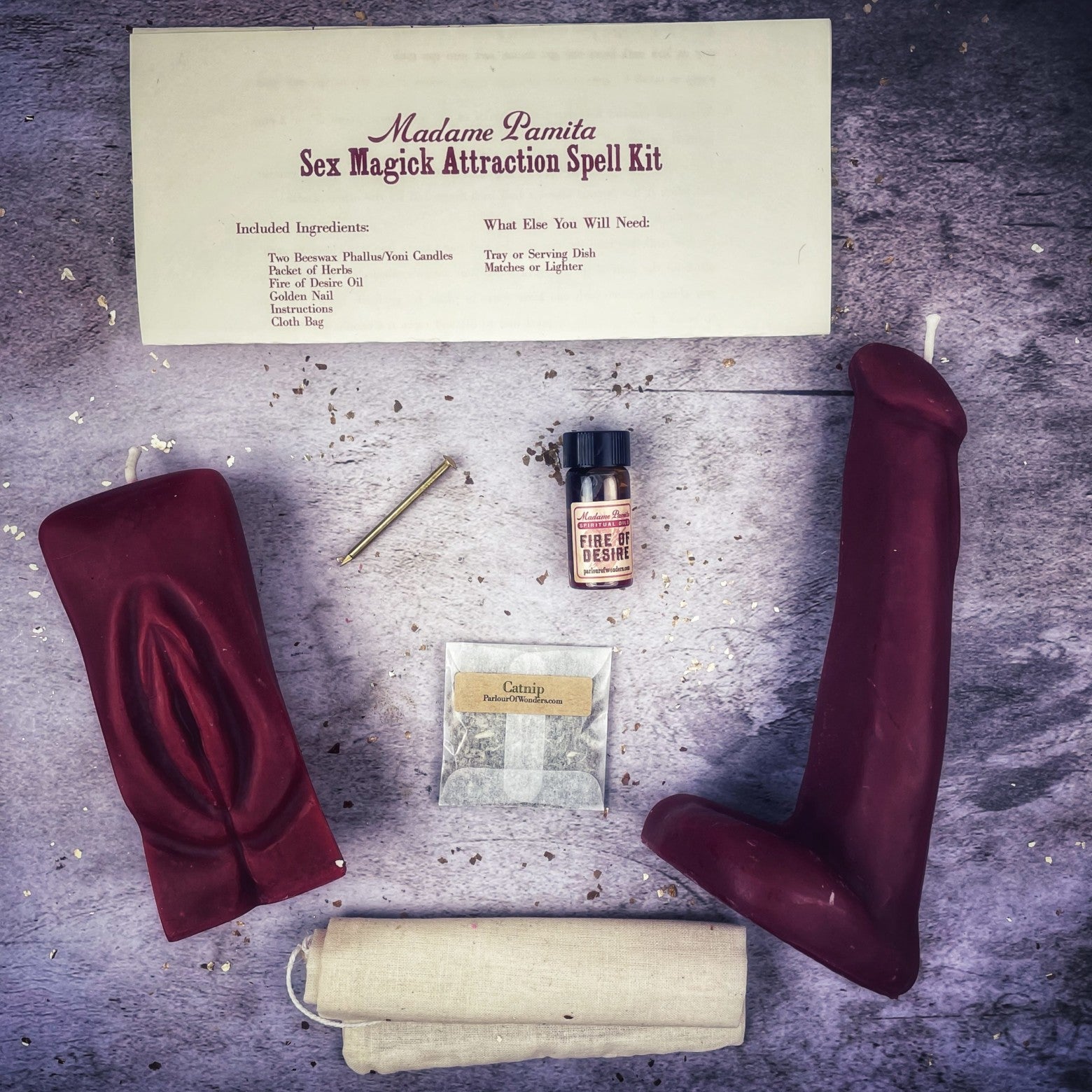Black candle spell kit with yoni and phallus symbols for passion and attraction by Parlour of Wonders, designed for sex magick rituals.