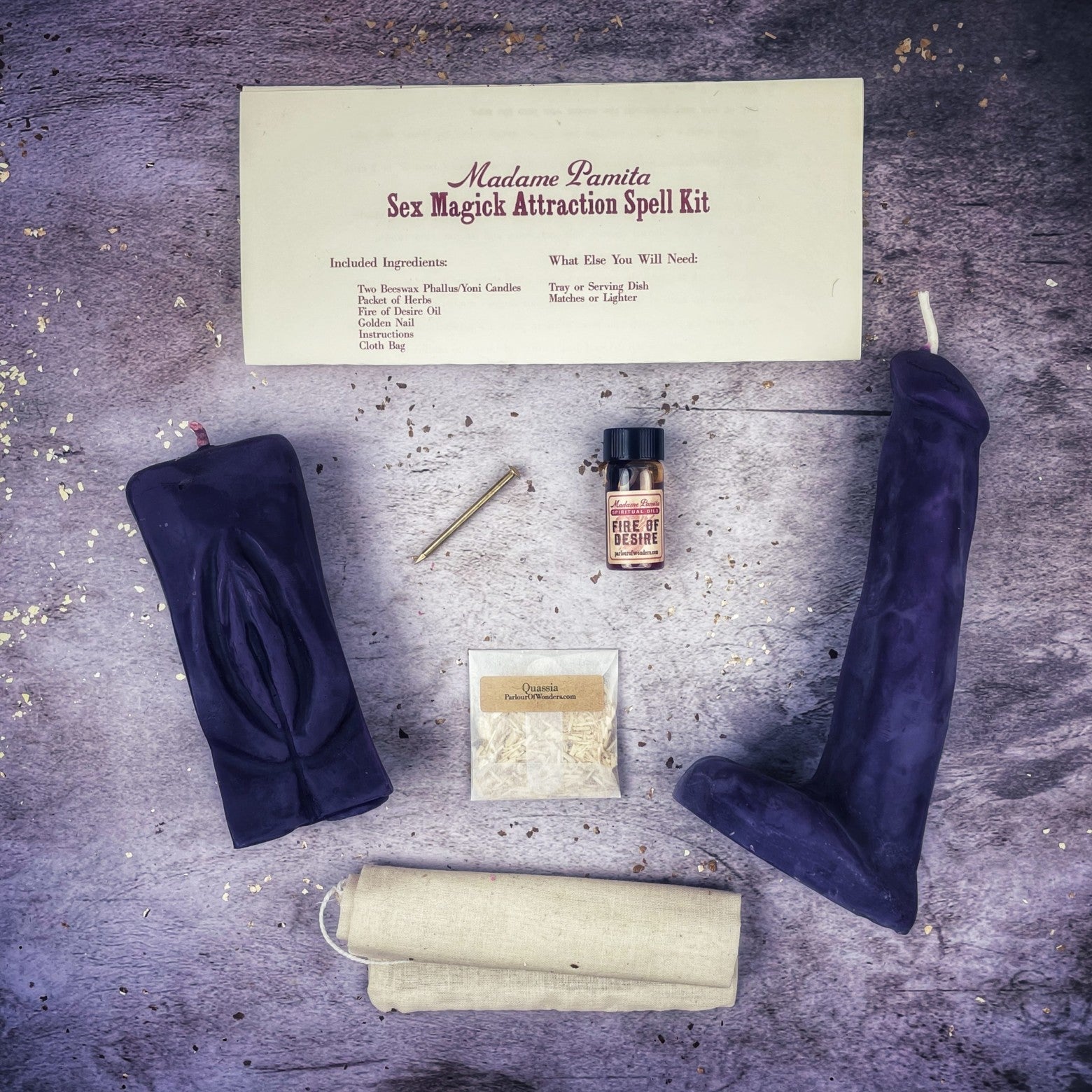 Black candle spell kit with yoni and phallus symbols, designed for passion and attraction magic, from Parlour of Wonders.