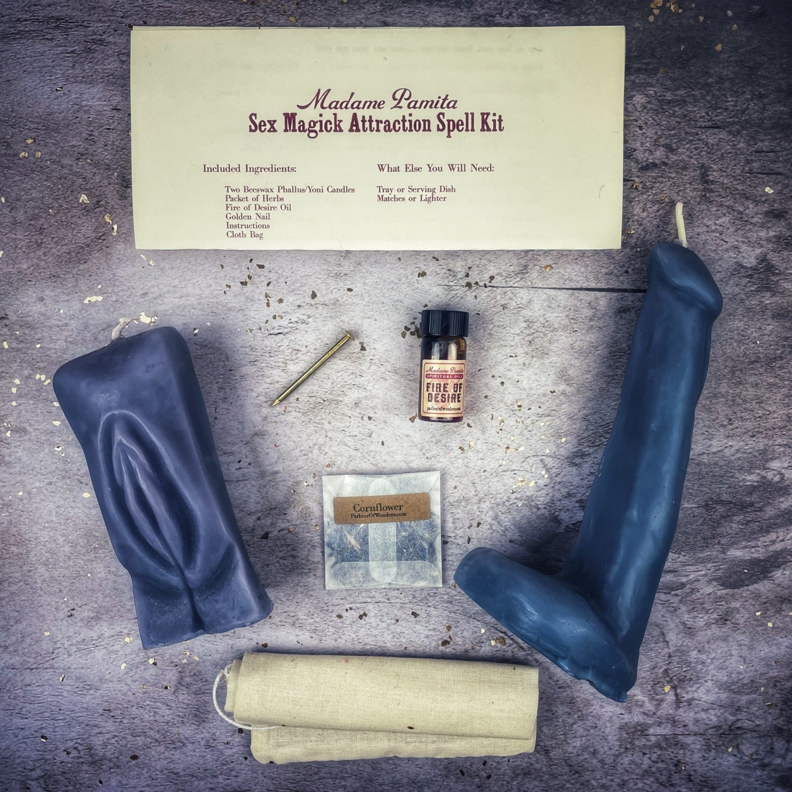 Black candle spell kit by Parlour of Wonders featuring yoni and phallus symbols for passion and attraction magic.
