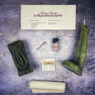 Black candle spell kit with yoni and phallus symbols for passion and attraction, designed for sex magick rituals by Parlour of Wonders.
