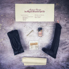 Black candle spell kit by Parlour of Wonders featuring yoni and phallus symbols for passion and attraction magic.