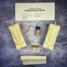 Black candle spell kit by Parlour of Wonders for passion and desire, featuring a Yoni-themed candle and ritual accessories.
