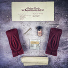 Black candle spell kit for passion and desire with Yoni symbols, designed for sex magick by Parlour of Wonders.