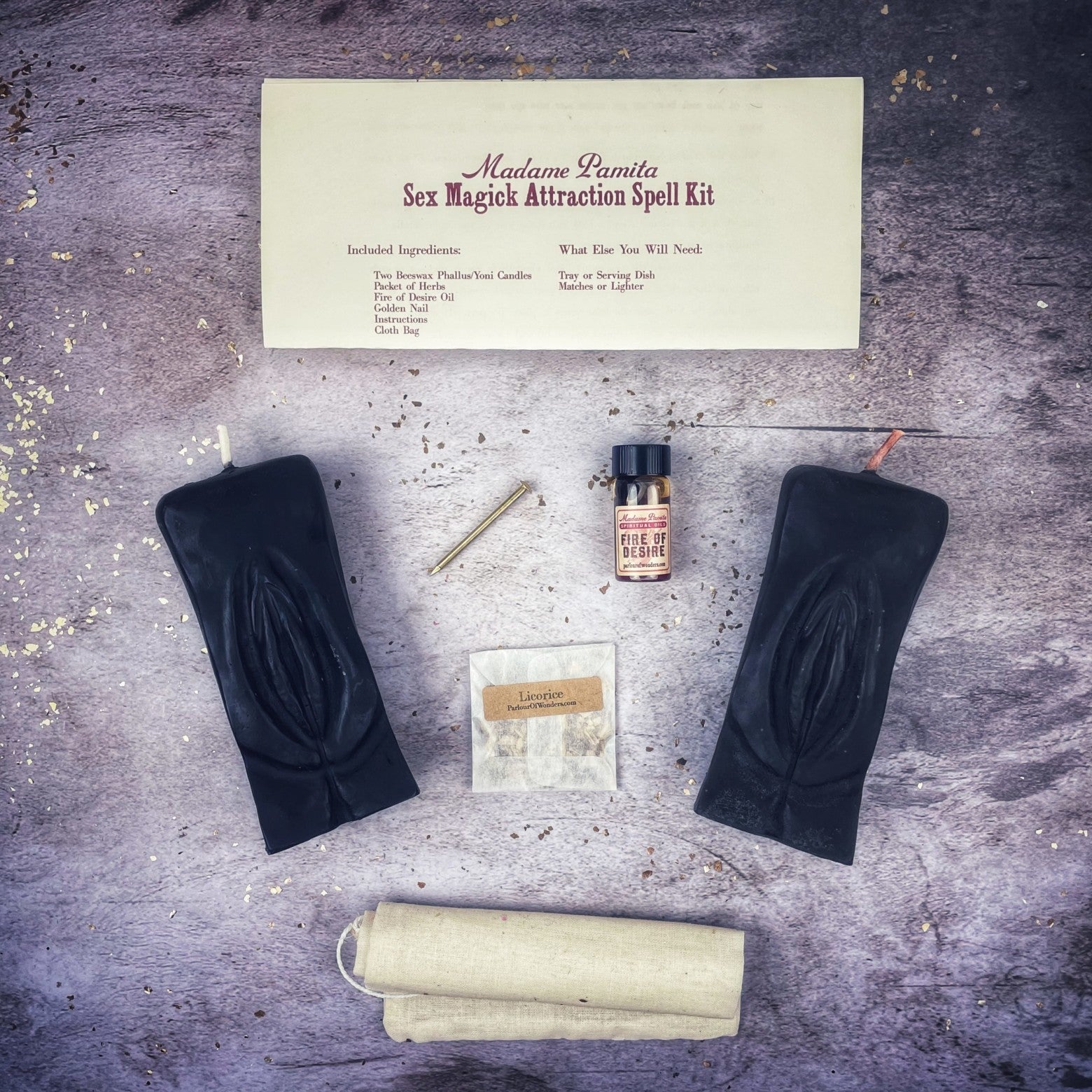 Black candle spell kit from Parlour of Wonders with herbs and symbols for enhancing passion and desire through sex magick rituals.