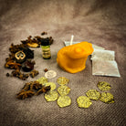 Parlour of Wonders Lucky Money Frog Candle Spell Kit for abundance and prosperity, featuring black candles and ritual accessories.