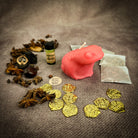 Lucky Money Frog Candle Spell Kit by Parlour of Wonders for abundance and prosperity, featuring black candles and related spell components.