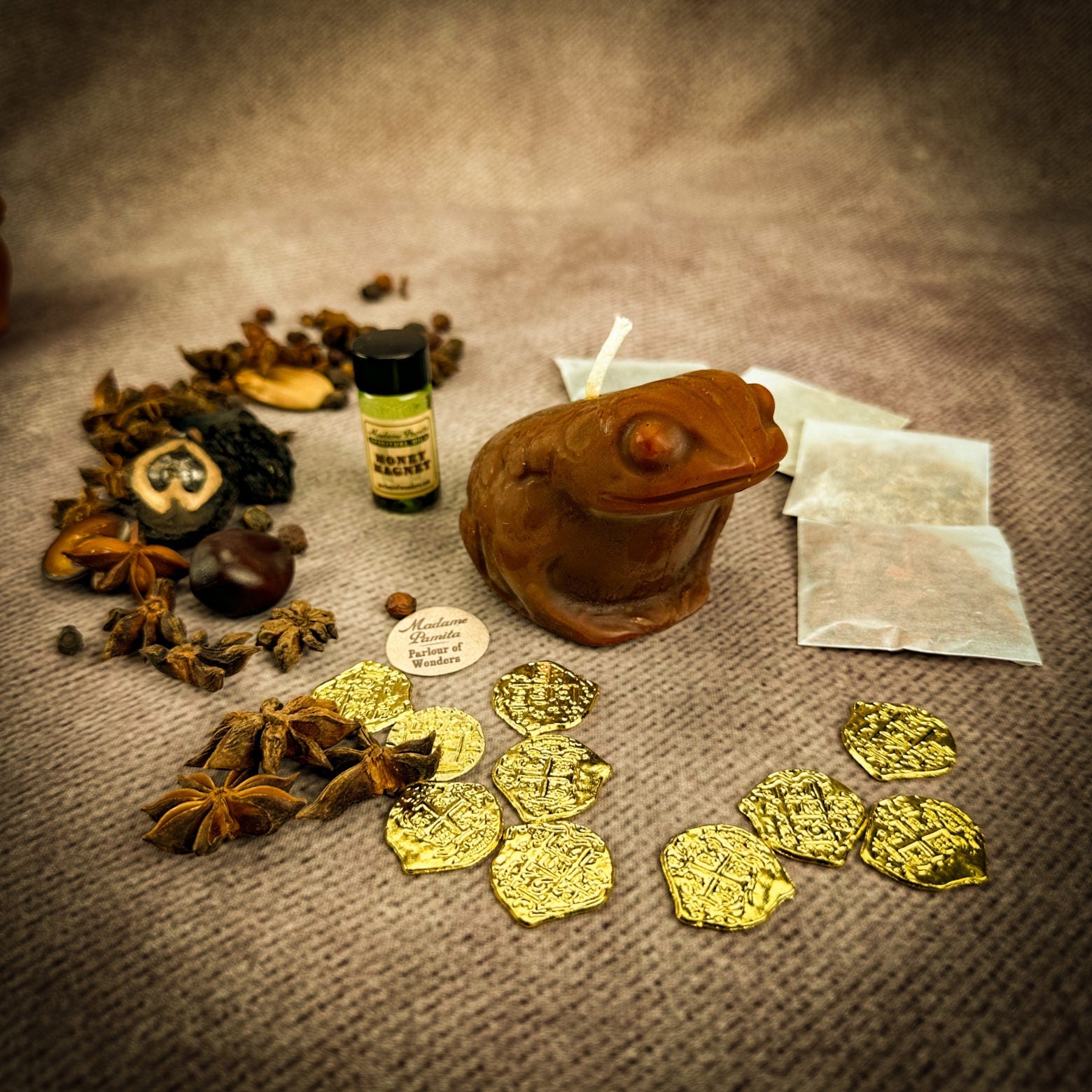Lucky Money Frog Candle Spell Kit by Parlour of Wonders, featuring black candles and charms for abundance and prosperity.
