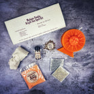Bright Sun Candle Spell Kit by Parlour of Wonders featuring black candles for success, fame, protection, and radiant energy.