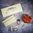 Black Cauldron of Magick Candle Spell Kit by Parlour of Wonders with candles and tools for transformation and positive change.