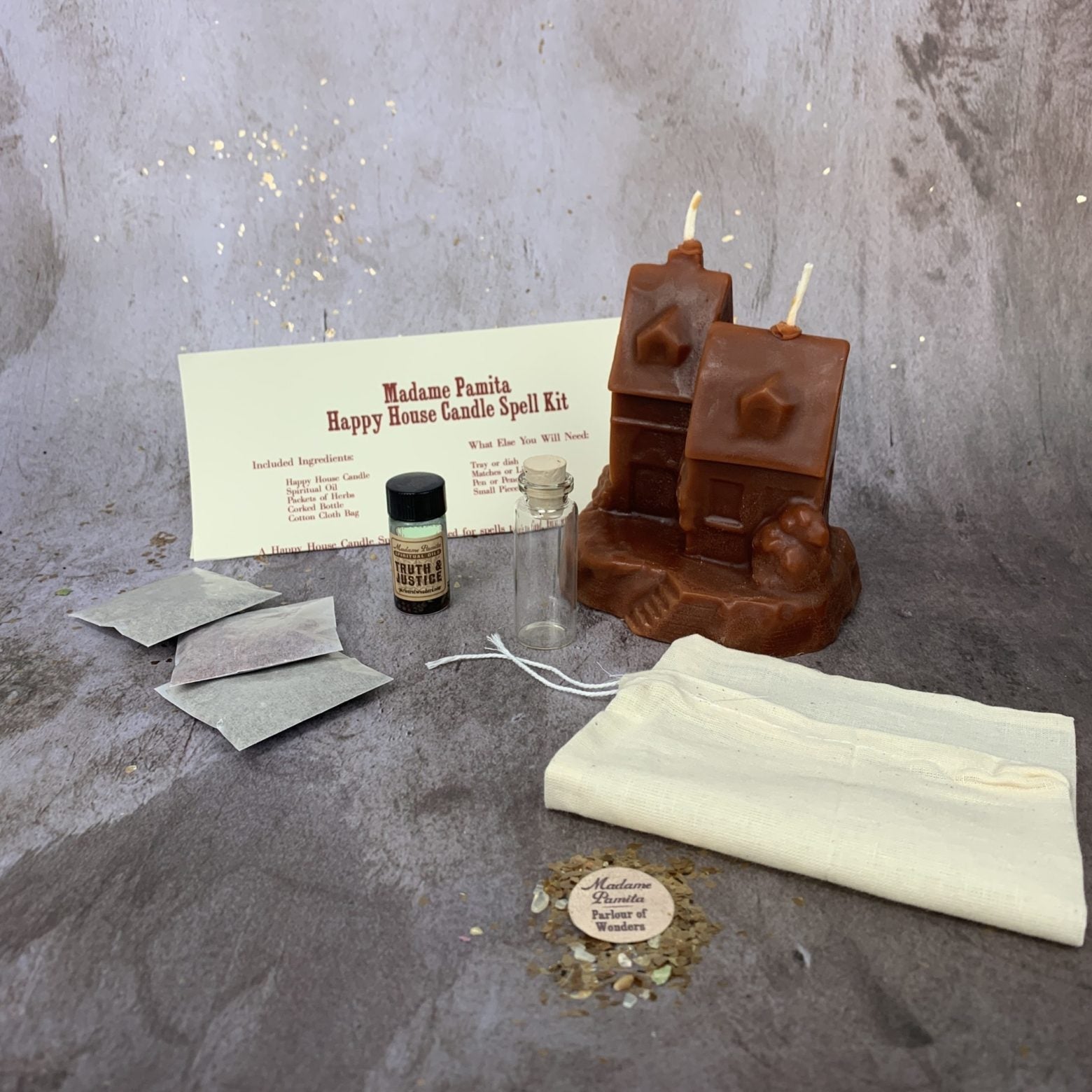 Happy House Candle Spell Kit by Parlour of Wonders featuring black candles and herbs for home protection, harmony, and blessings.