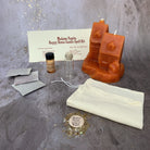 Parlour of Wonders candle spell kit with black candles and herbs for home protection, harmony, and blessings.