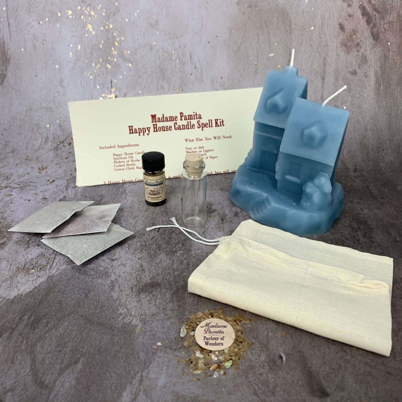 Parlour of Wonders Happy House Candle Spell Kit with black candles, herbs, and instructions for home protection and harmony.