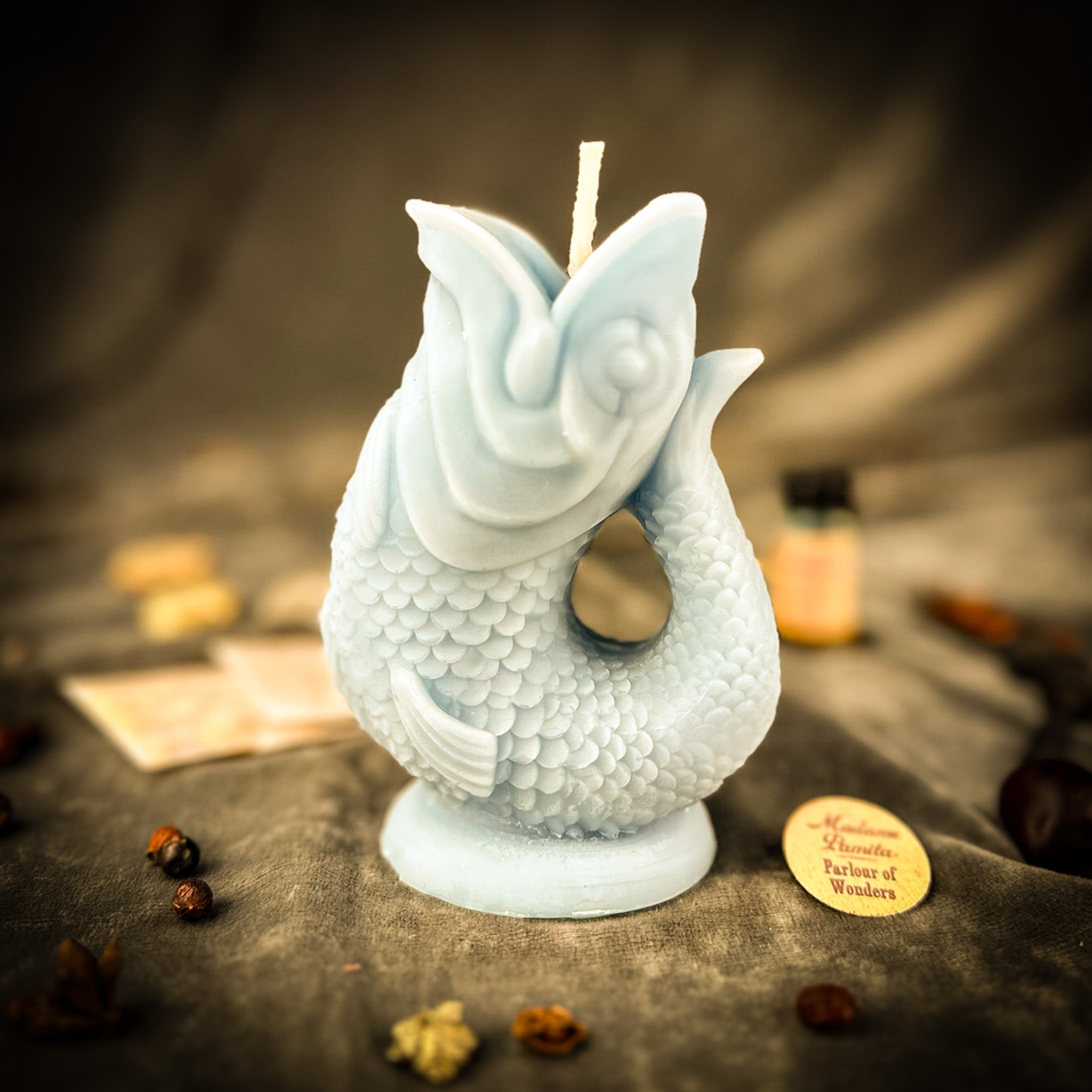 Blue Magic Fish Wishing Candle Spell Kit by Parlour of Wonders for manifestation and dream magic, featuring candles and mystical symbols.