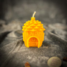 Pinecone of Protection Candle Spell Kit by Parlour of Wonders with fairy magic and guardian energy elements on a brown background.