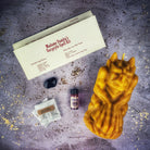 Brown Gargoyle Protection Candle Spell Kit from Parlour of Wonders with guardian magic symbols and spell components for protection.