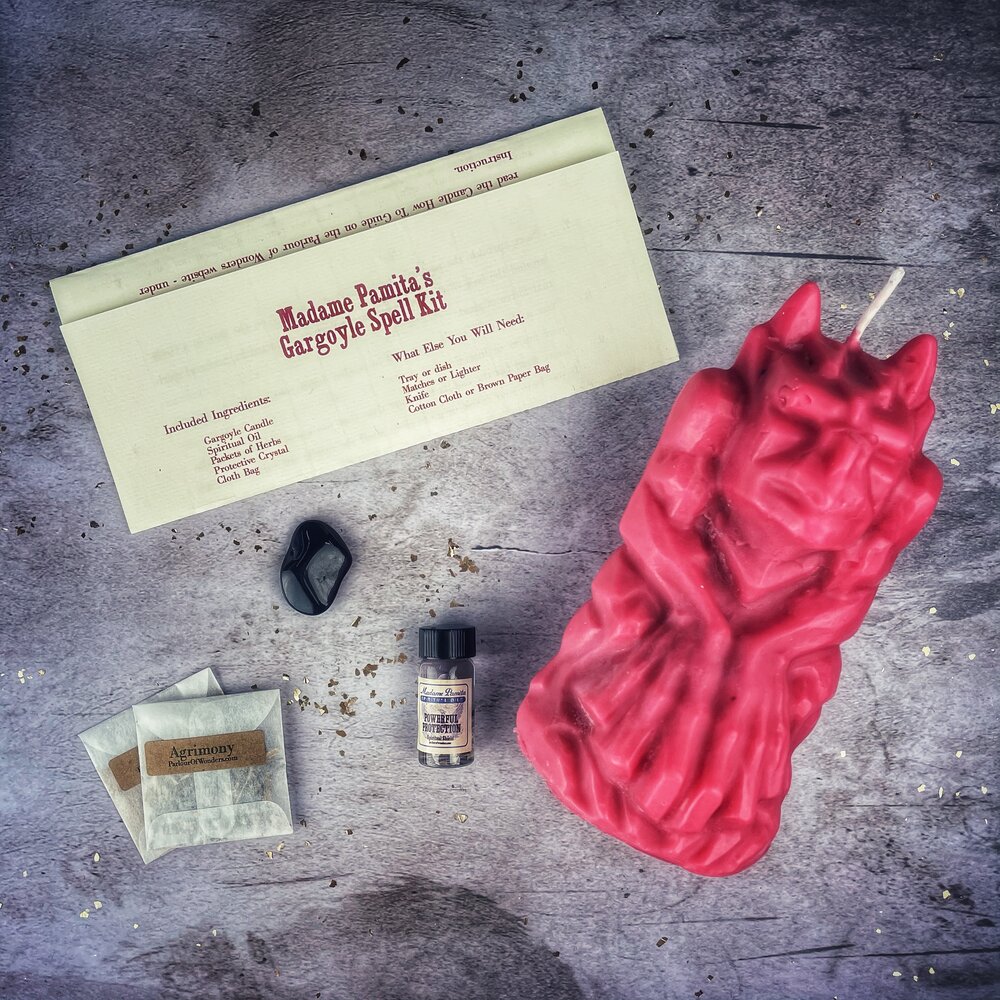 Parlour of Wonders Gargoyle Protection Candle Spell Kit with brown candle, guardian magic symbols, and protective charms for legal matters