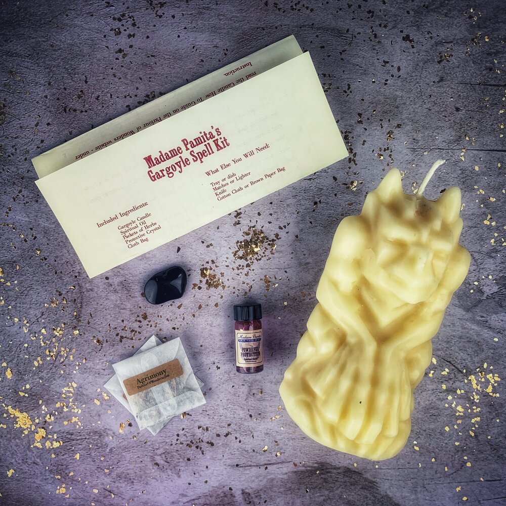 Brown Gargoyle Protection Candle Spell Kit by Parlour of Wonders with candles, spell components, and symbols for guardian magic.