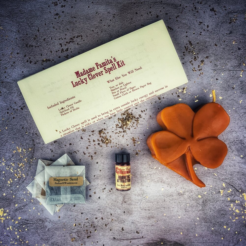 Green Candle Spell Kit by Parlour of Wonders with lucky clover symbols for good fortune and attracting luck.