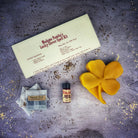 Green Candle Spell Kit for luck and good fortune from Parlour of Wonders, featuring a lucky clover design and spell ingredients.
