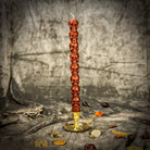 Orange Eight Day Skull Taper Candle Spell Kit by Parlour of Wonders for mind influence and ancestral wisdom rituals.