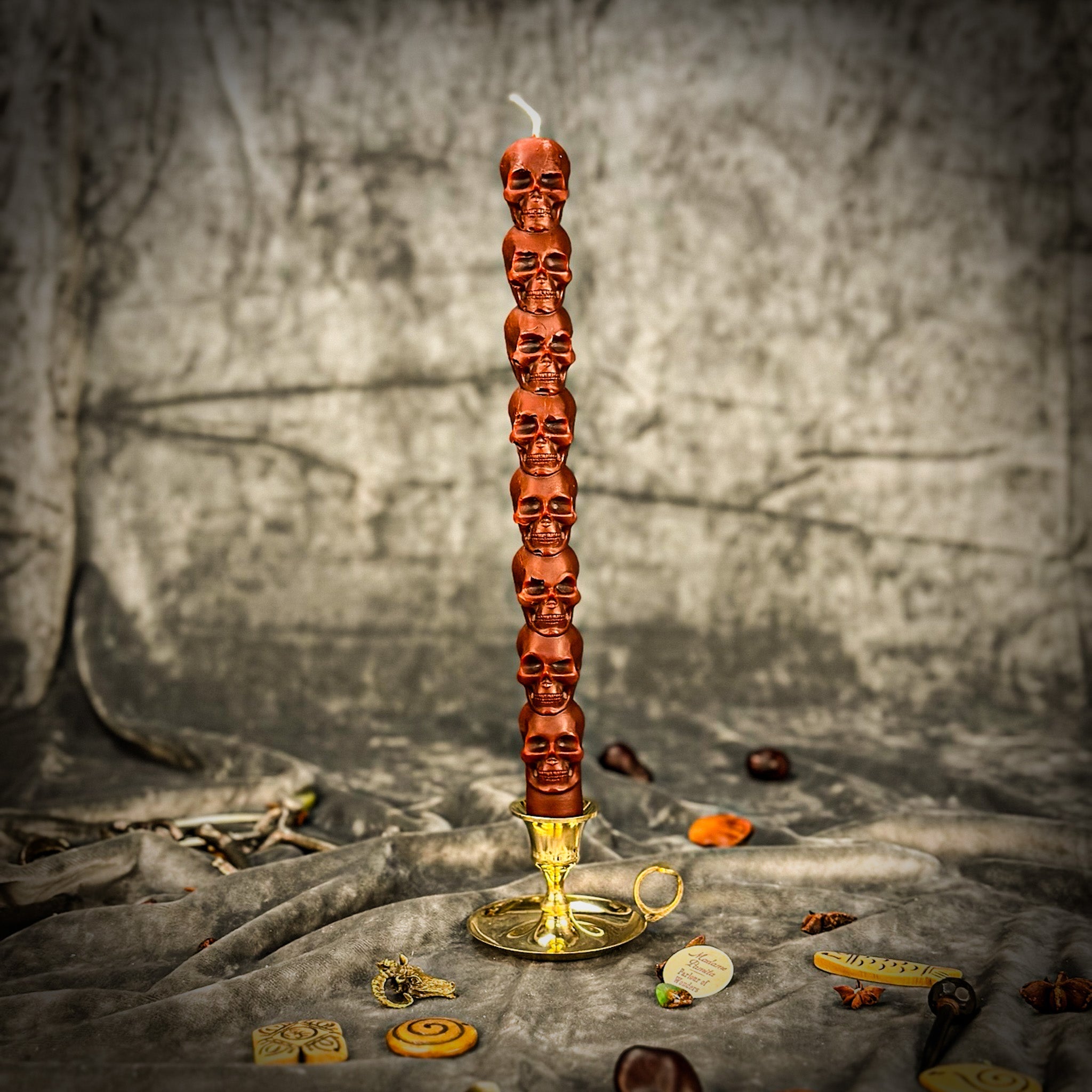 Orange Eight Day Skull Taper Candle Spell Kit by Parlour of Wonders for mind influence and ancestral wisdom rituals.