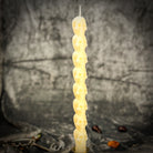 Orange Eight Day Skull Taper Candle Spell Kit by Parlour of Wonders for mind influence and ancestral wisdom rituals.