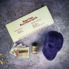 Parlour of Wonders Skull Candle Spell Kit with orange candle for mental influence, mind control, and mental clarity.