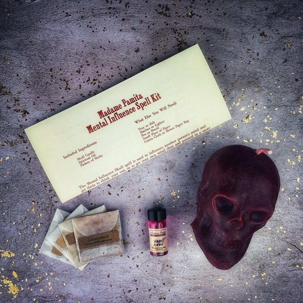 Parlour of Wonders Mental Influence Skull Candle Spell Kit with orange candles for mind control and mental clarity.
