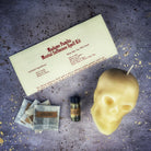 Parlour of Wonders Mental Influence Skull Candle Spell Kit with orange candles for mind control and mental clarity.