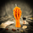 Parlour of Wonders Didukh Candle Spell Kit with orange candles for calling ancestors and new beginnings in a natural setting.