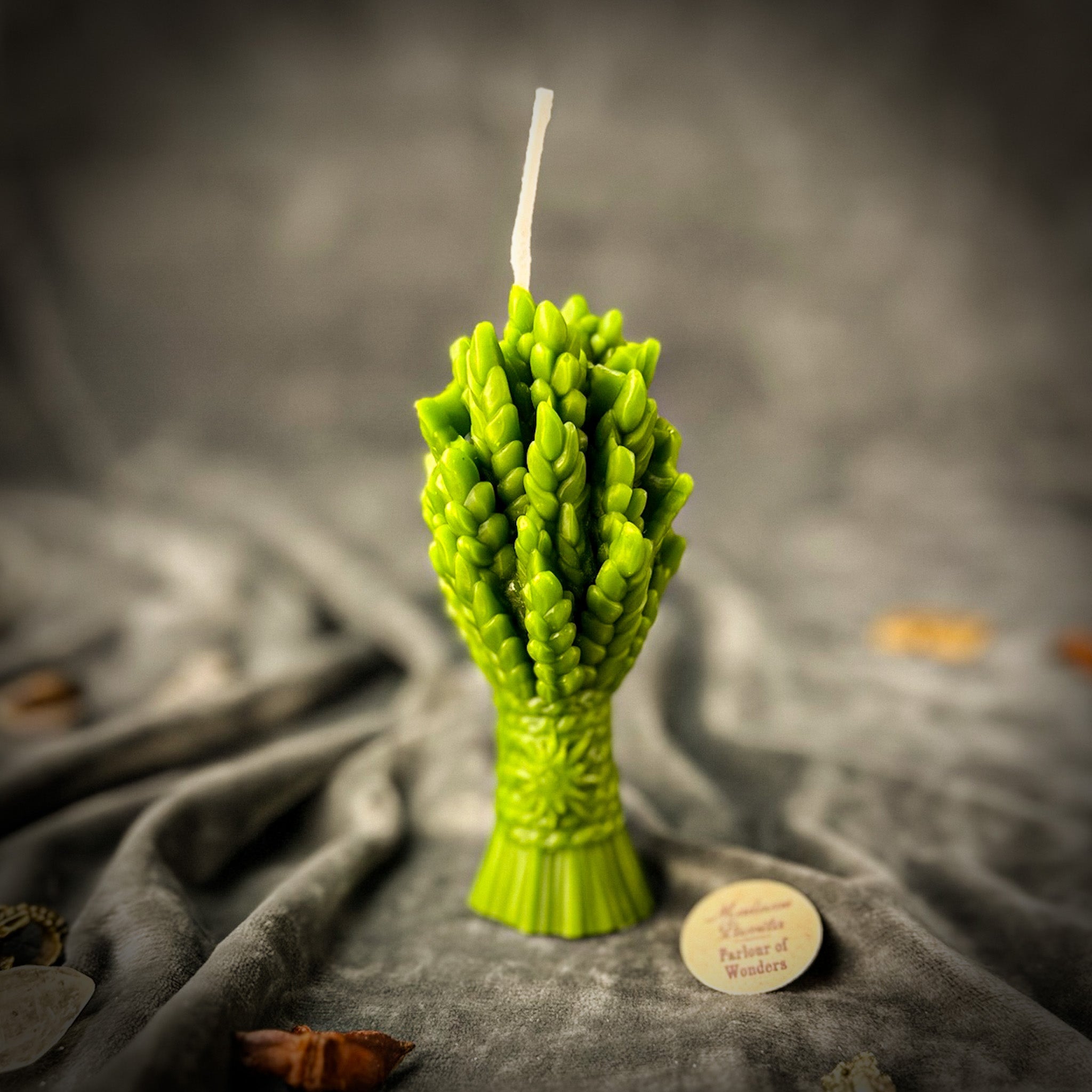 Parlour of Wonders Didukh Candle Spell Kit with orange candles for new beginnings and calling ancestors in a natural setting.