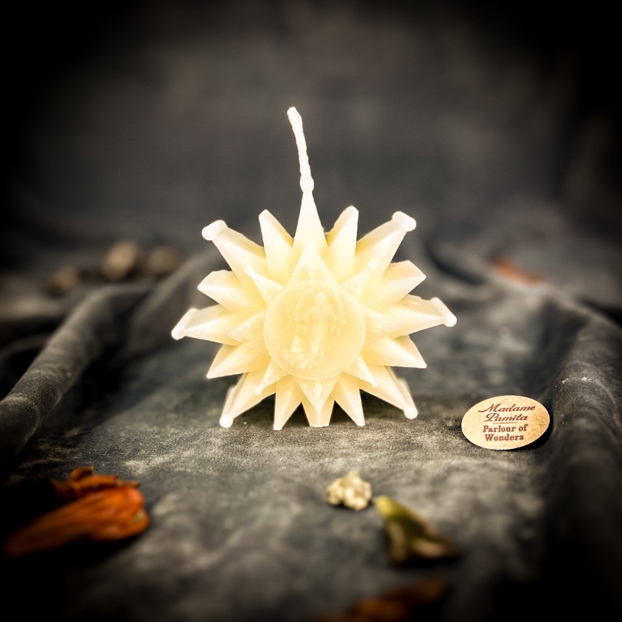 Winter Wishing Star Candle Spell Kit by Parlour of Wonders featuring orange candles and spell components for new beginnings.