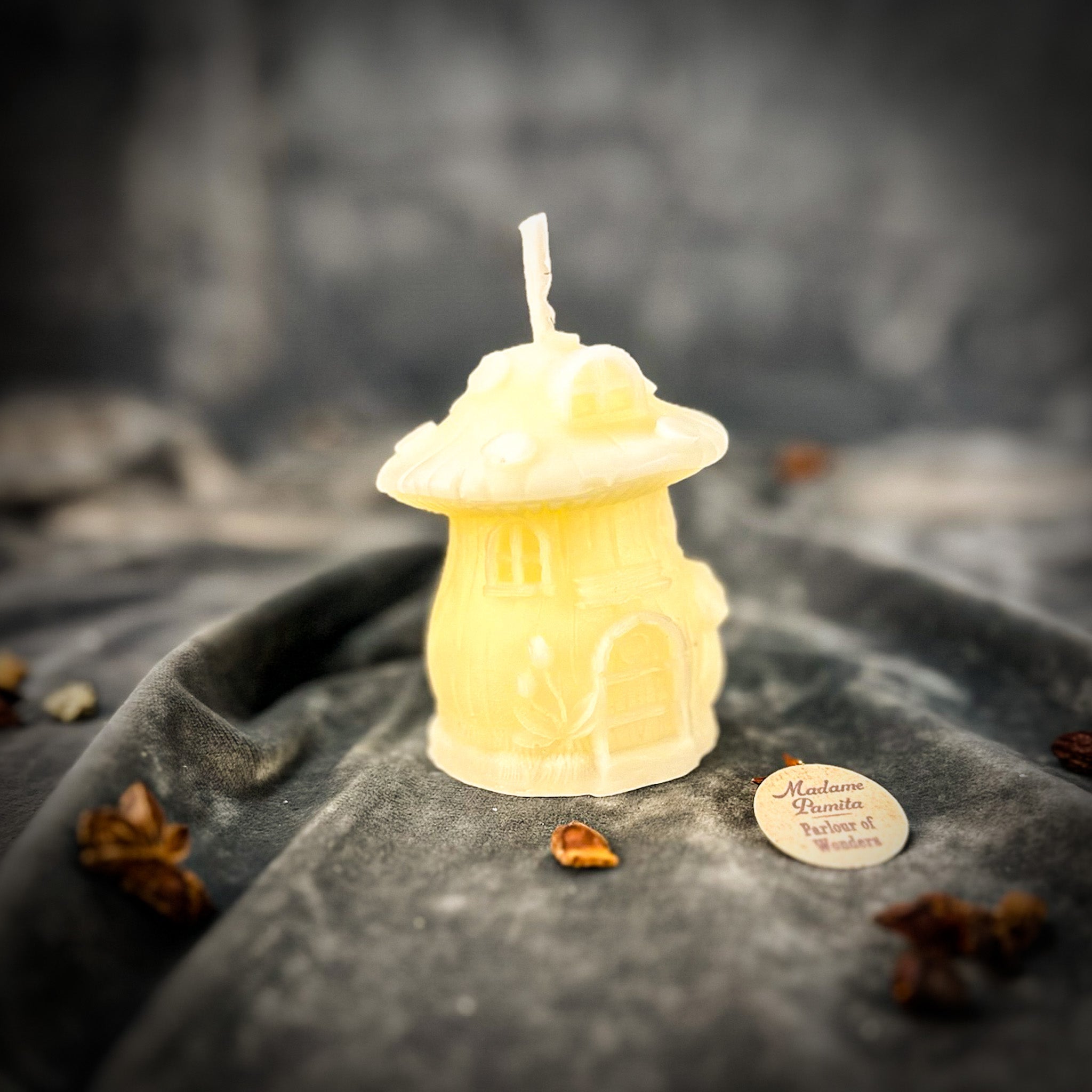 Cleansing Mushroom Fairy Hut Candle Spell Kit by Parlour of Wonders featuring orange candles and mystical purification and renewal elements.
