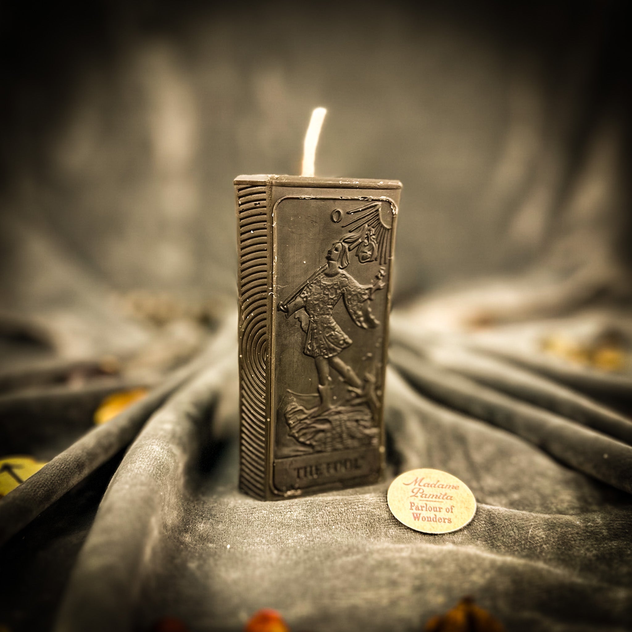 Parlour of Wonders Fool Candle Spell Kit with orange candles for new beginnings and adventure magic, featuring mystical symbols and herbs.