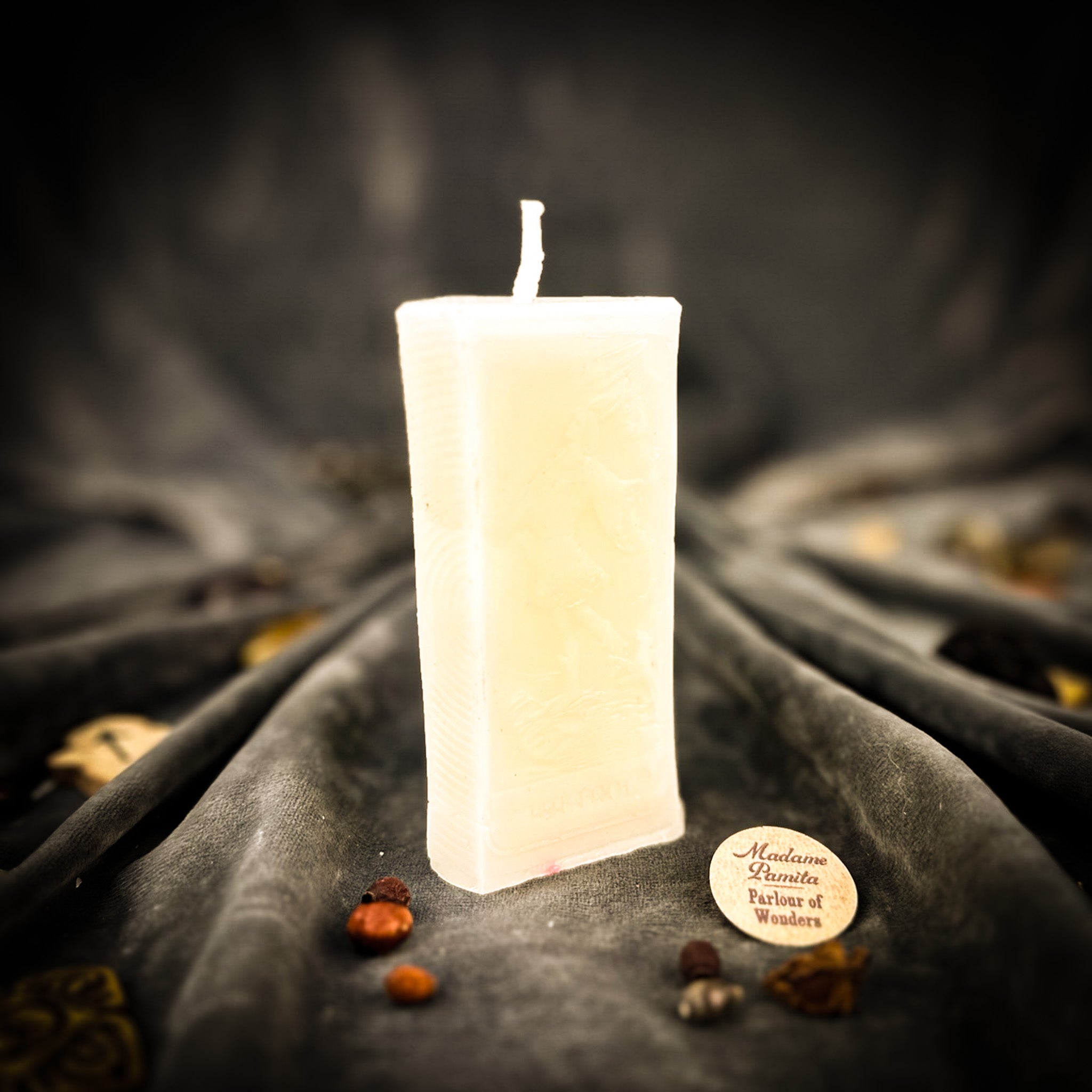 Parlour of Wonders Candle Spell Kit with orange candles for new beginnings and adventure magic, featuring The Fool symbol.