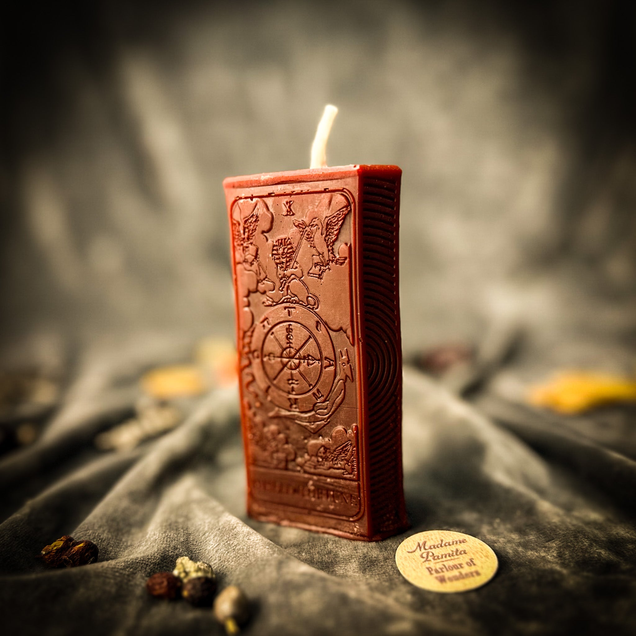 Orange Wheel of Fortune Candle Spell Kit by Parlour of Wonders, featuring candles and herbs for luck and opportunity magic.