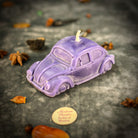 Parlour of Wonders Charmed Car Candle Spell Kit with pink candle for safe travels and successful shopping, featuring decorative elements.