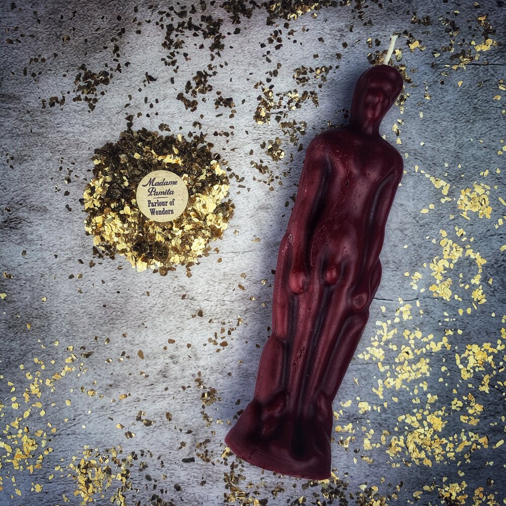 Pink male figural candle from Parlour of Wonders Candle Spell Kit, used for sympathetic magic and personal power rituals.