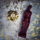 Pink male figural candle from Parlour of Wonders Candle Spell Kit, used for sympathetic magic and personal power rituals.