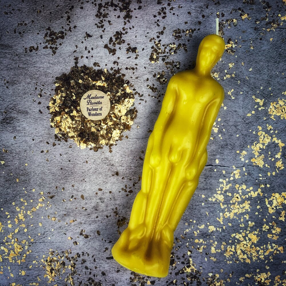 Pink male figural candle with ritual tools from Parlour of Wonders Candle Spell Kit for sympathetic magic and personal power.