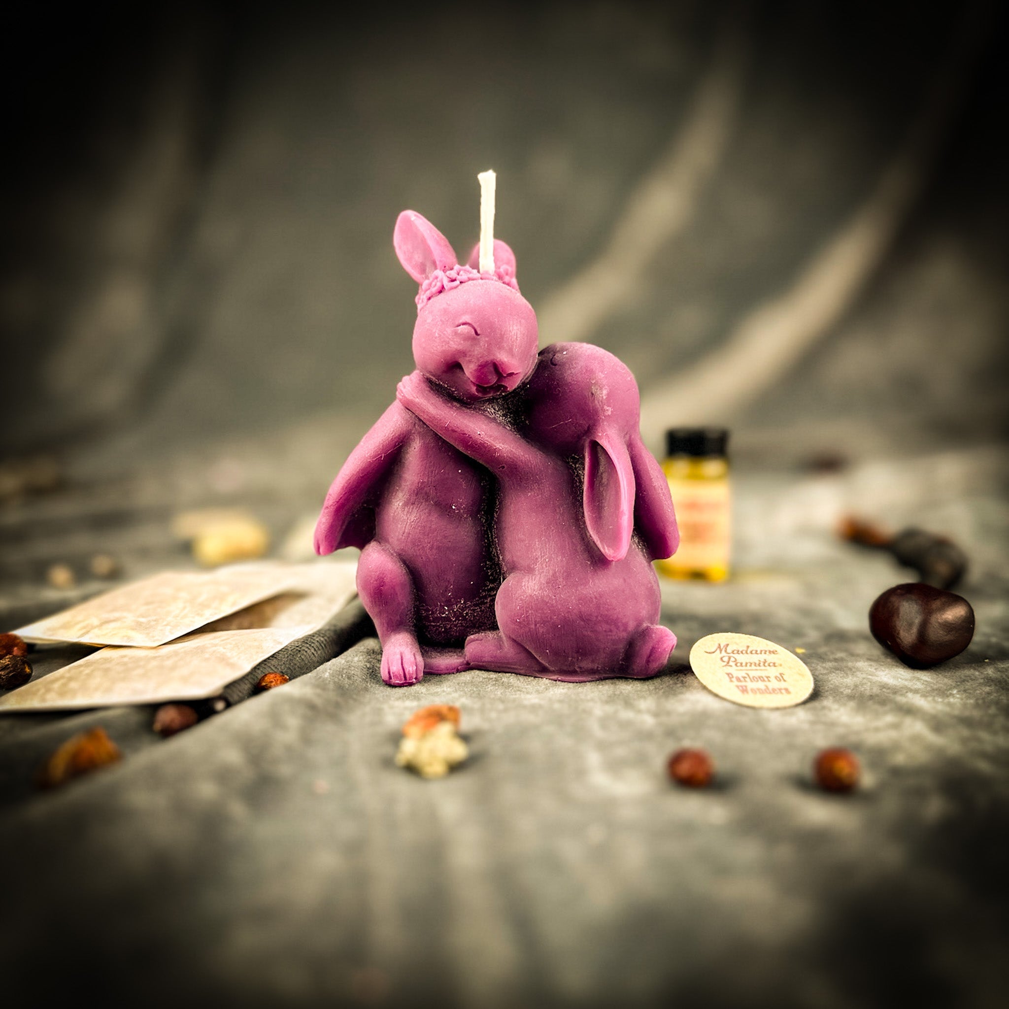 Purple Candle Spell Kit with rabbit motifs from Parlour of Wonders for good luck and new beginnings magic.