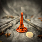 Purple Eiffel Tower travel candle spell kit by Parlour of Wonders, featuring a luxury candle for adventure and wanderlust magic.