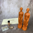 Parlour of Wonders Come to Me Candle Spell Kit with purple candle, designed to attract love and passion, featuring human figures.