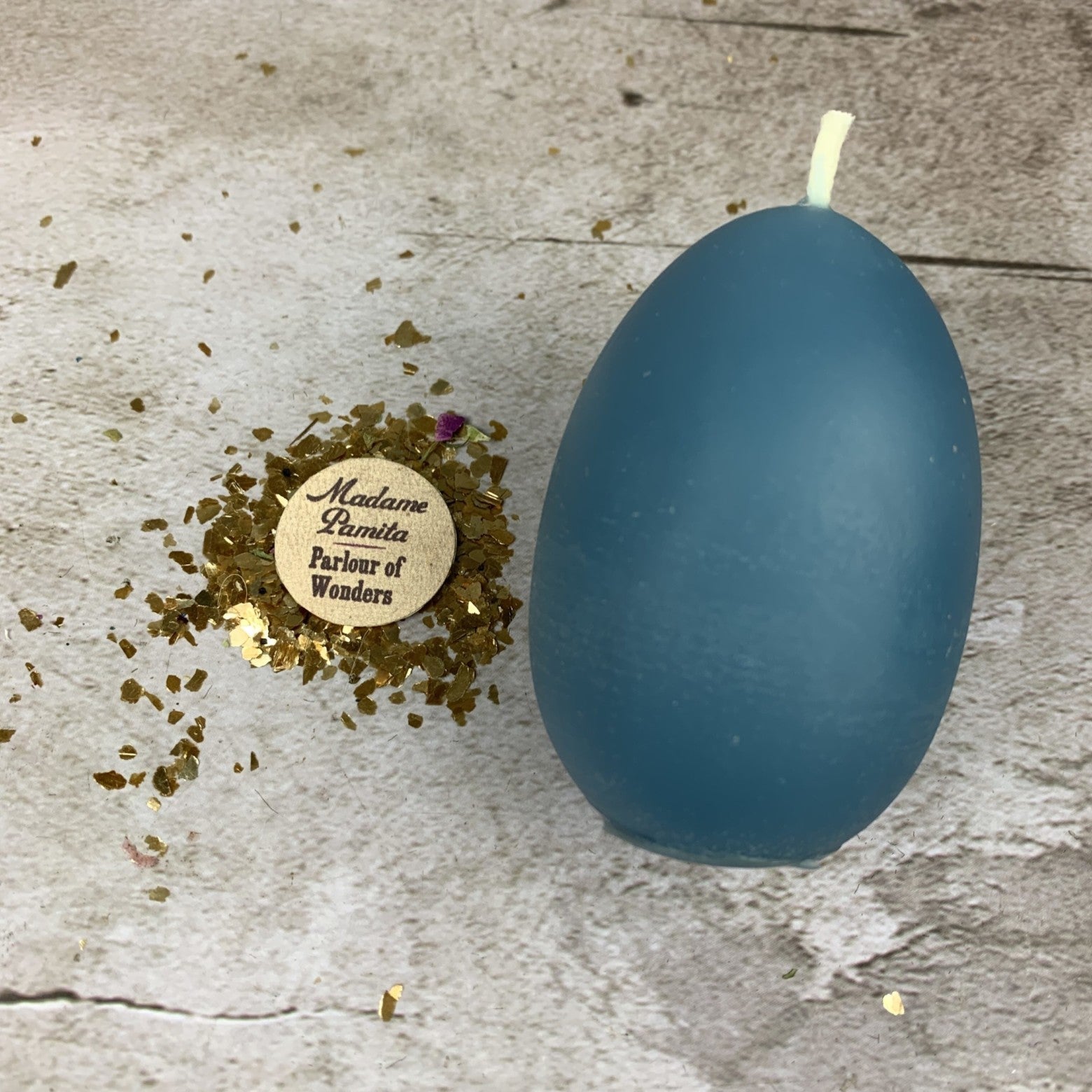 Purple Egg Talisman Candle Spell Kit from Parlour of Wonders for new beginnings and fertility magic, includes candles and magical tools.