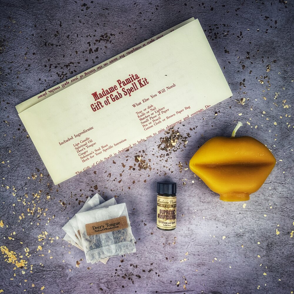 Parlour of Wonders Gift of Gab Candle Spell Kit with purple candles for eloquent speech and powerful communication.