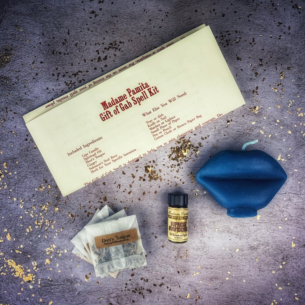 Parlour of Wonders Gift of Gab Candle Spell Kit with purple candles and herbs for eloquent speech and powerful communication.