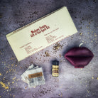 Parlour of Wonders Gift of Gab Candle Spell Kit with purple candles for eloquent speech and powerful communication.