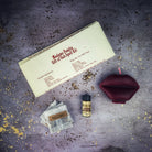 Parlour of Wonders Gift of Gab Candle Spell Kit with purple candles and spell components for eloquent speech and powerful communication.